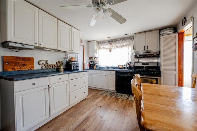 kitchen featuring black dishwasher, light wood-type flooring, white cabinetry, and a healthy amount of sunlight