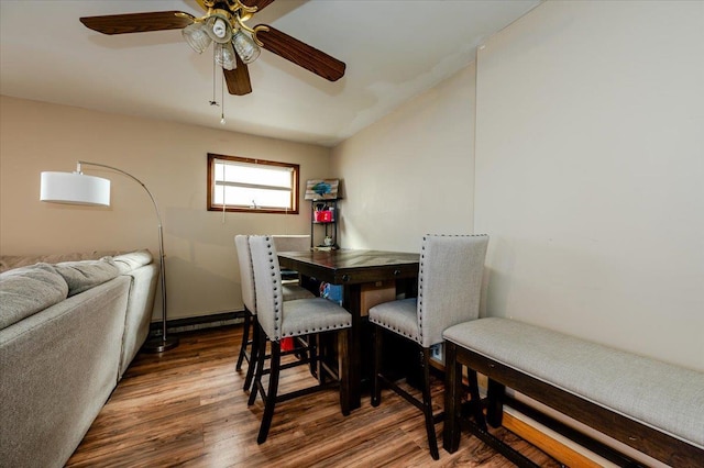 dining space featuring dark hardwood / wood-style floors and ceiling fan