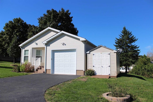 exterior space featuring a garage and a front lawn