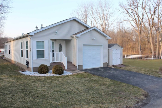 ranch-style home with a front lawn and a garage