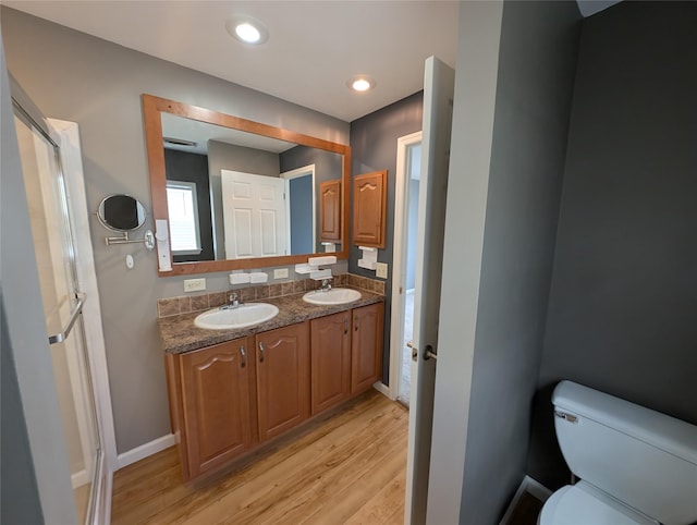 bathroom featuring hardwood / wood-style floors, vanity, and toilet