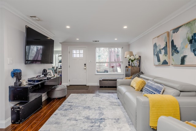 living room featuring ornamental molding and dark wood-type flooring