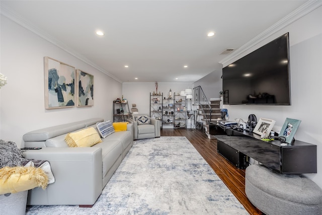 living room with crown molding and hardwood / wood-style floors