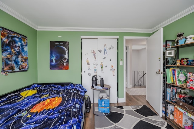 bedroom featuring crown molding and wood-type flooring