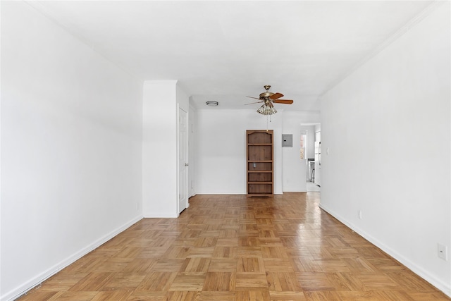 unfurnished room featuring ceiling fan and light parquet floors