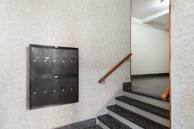 staircase featuring mail boxes