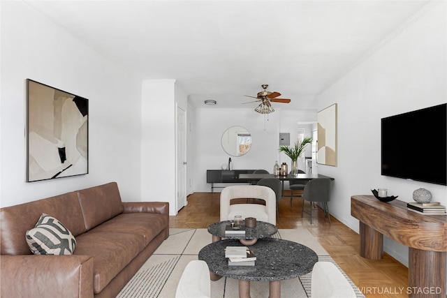 living room with ceiling fan and light parquet flooring