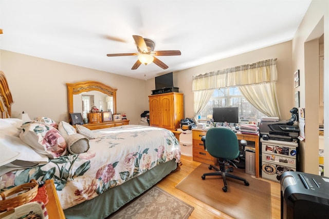 bedroom with light wood-type flooring and ceiling fan