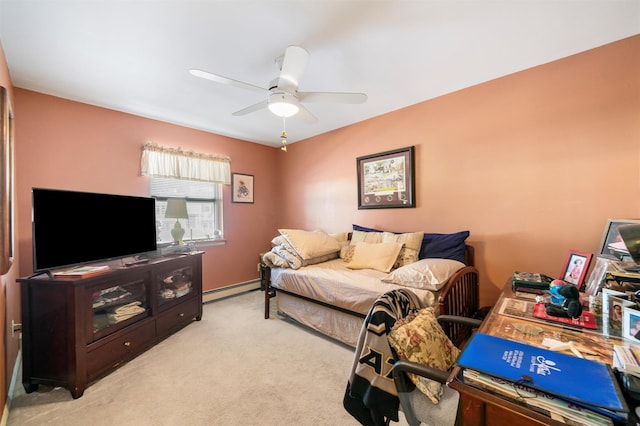 bedroom with light carpet, baseboard heating, and ceiling fan