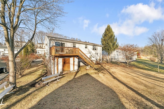 rear view of house featuring a deck