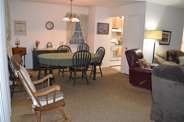 dining room with light colored carpet and an inviting chandelier