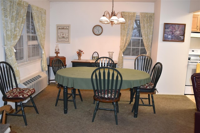 carpeted dining space featuring a notable chandelier