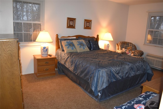 carpeted bedroom with an AC wall unit