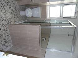 bathroom featuring backsplash and walk in shower