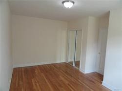 empty room with wood-type flooring