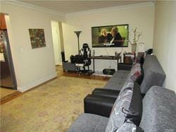 living room with ornamental molding