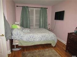 bedroom with wood-type flooring