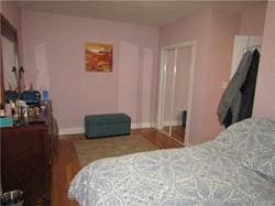 bedroom with wood-type flooring