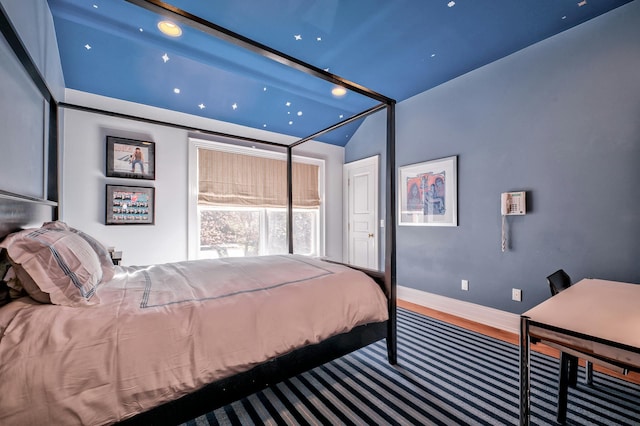 bedroom featuring lofted ceiling