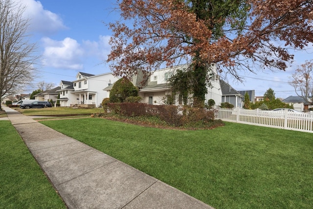 view of side of home featuring a lawn