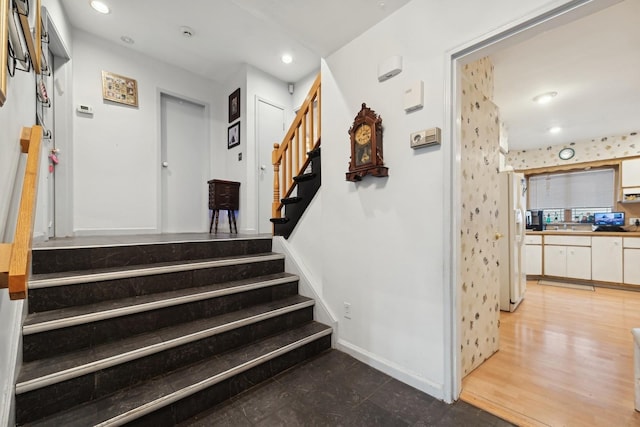 staircase featuring hardwood / wood-style flooring