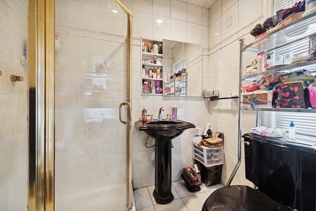 bathroom featuring tile patterned flooring, tile walls, and walk in shower