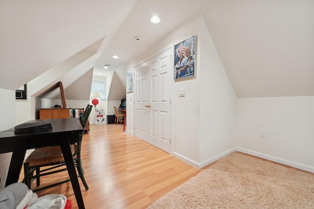 bonus room featuring hardwood / wood-style floors and vaulted ceiling