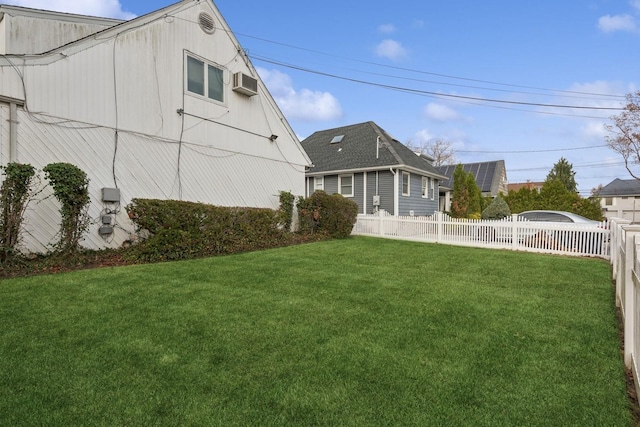 view of yard featuring a wall mounted AC