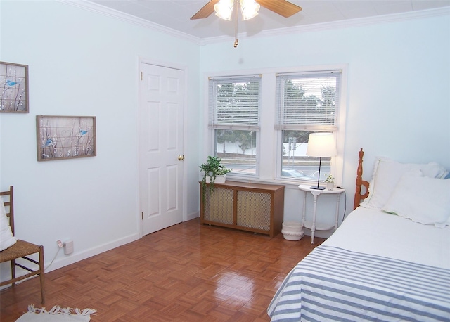 bedroom with radiator, ceiling fan, crown molding, and parquet flooring