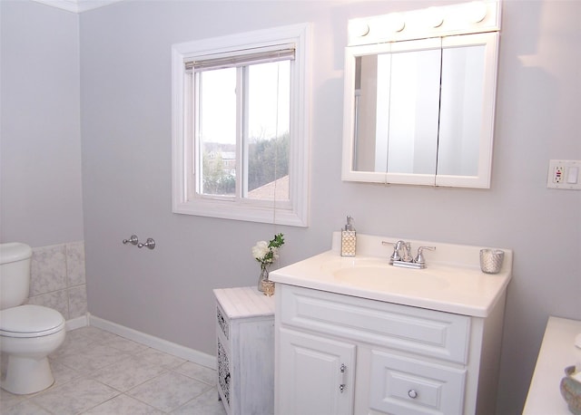 bathroom with tile patterned floors, vanity, and toilet