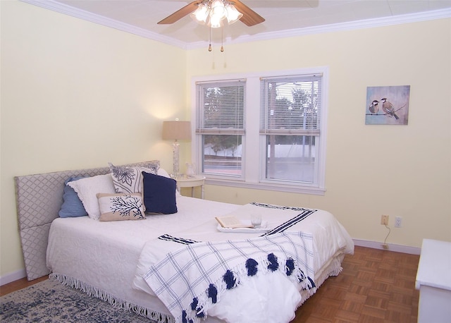 bedroom featuring dark parquet flooring, ceiling fan, and crown molding