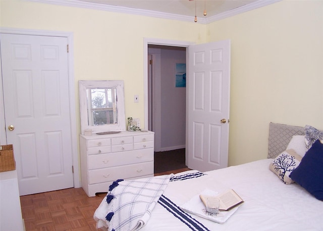 bedroom featuring parquet flooring and crown molding