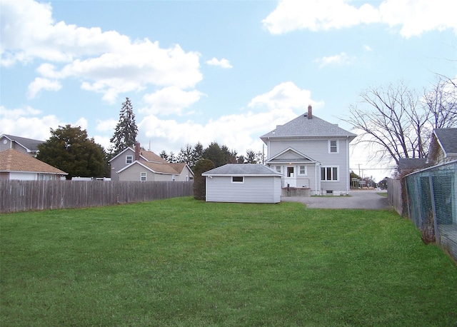 back of property featuring a yard and a patio