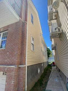 view of side of home with a garage