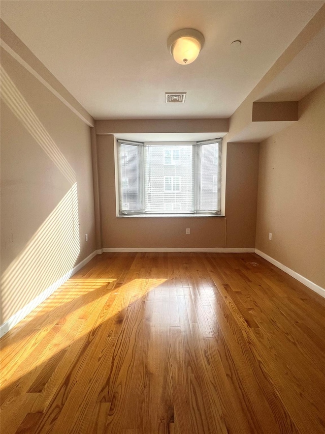 unfurnished room featuring light hardwood / wood-style flooring