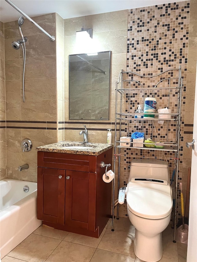 full bathroom featuring tile patterned floors, vanity, tile walls, and tiled shower / bath