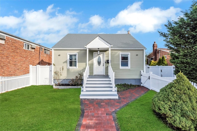 bungalow-style home featuring a front lawn