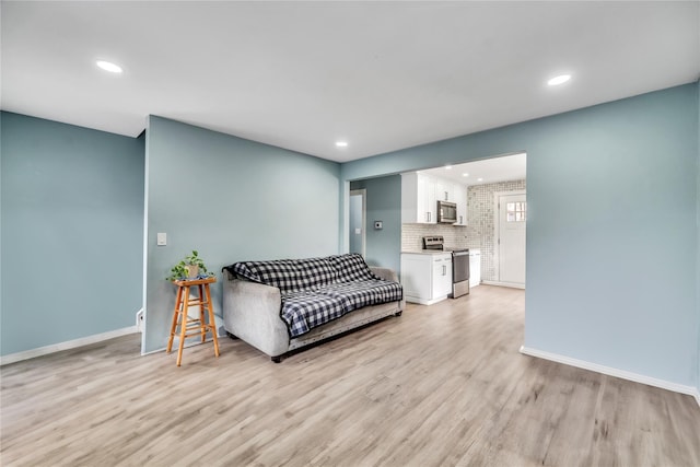 living room with light hardwood / wood-style flooring