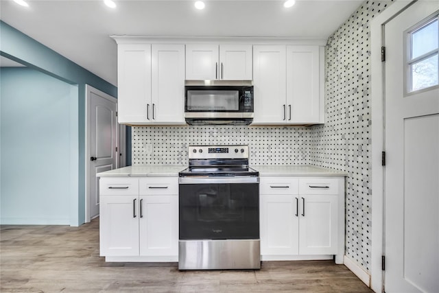 kitchen with white cabinetry and stainless steel appliances