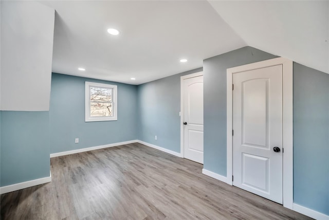 basement featuring light wood-type flooring