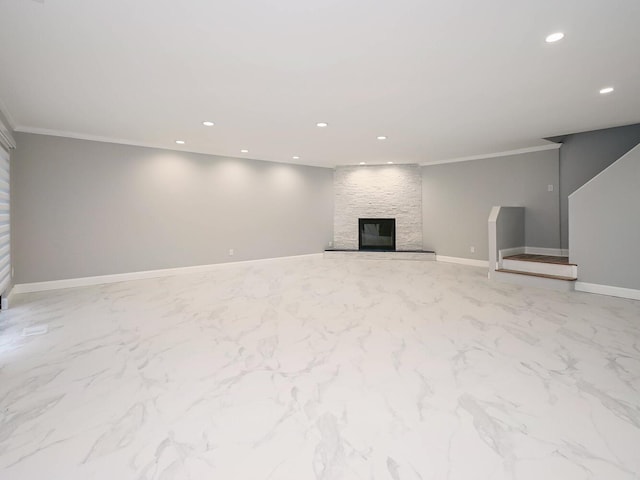 unfurnished living room with a stone fireplace and crown molding