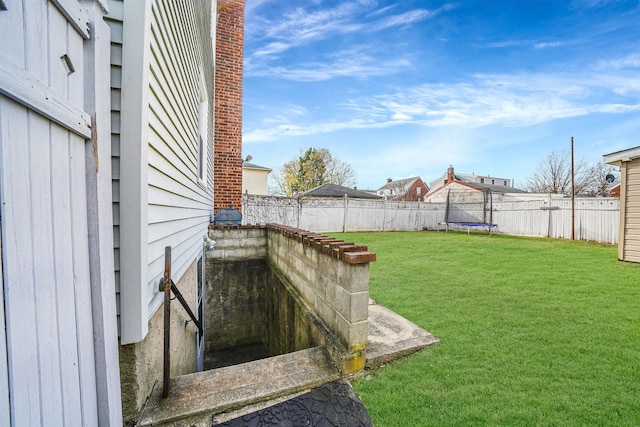 view of yard featuring a trampoline