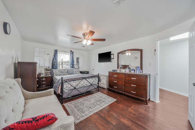 bedroom featuring dark hardwood / wood-style flooring and ceiling fan