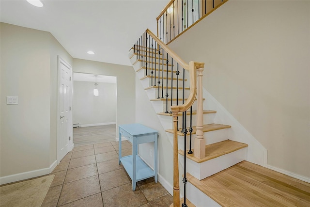 stairs with wood-type flooring