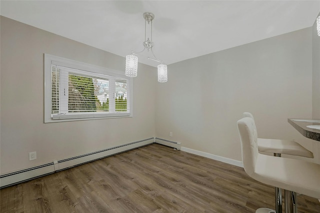 interior space featuring hardwood / wood-style floors and baseboard heating