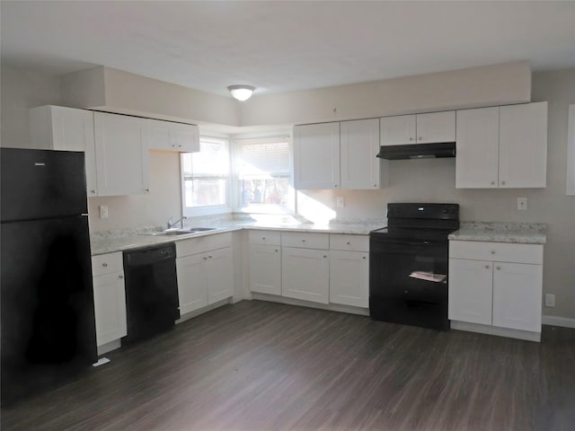 kitchen featuring dark hardwood / wood-style flooring, white cabinets, black appliances, and sink