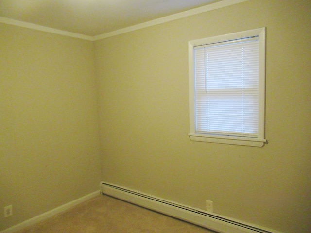 empty room with carpet flooring, crown molding, and a baseboard heating unit