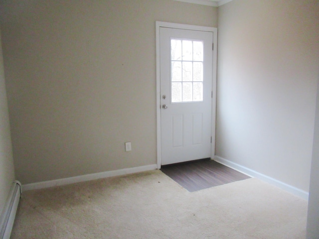 doorway to outside featuring carpet flooring and a baseboard radiator