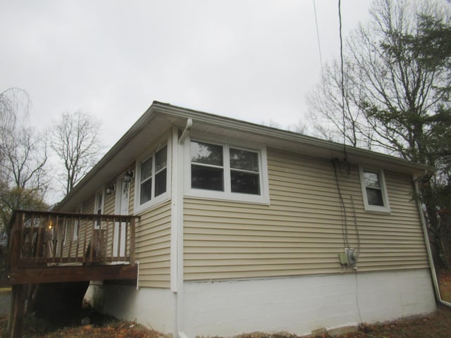 view of side of property with a deck