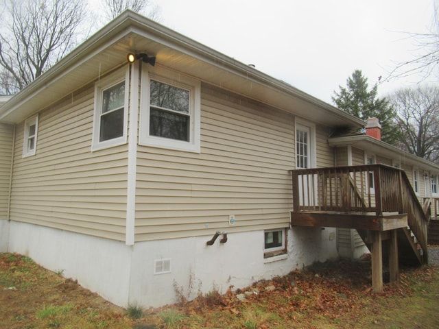 view of home's exterior with a deck